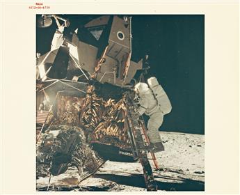 (NASA) Group of 24 color photographs, including the iconic image by Neil Armstrong of Buzz Aldrin walking on the moon, the Earthrise, a